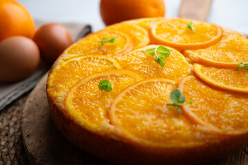 Orange upside-down cake. Delicious homemade sponge cake with organic orange slices.