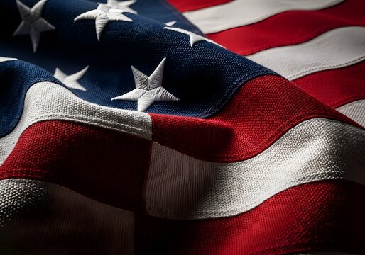 Waving American flag in a dramatic close-up view, the stars and stripes representing patriotism, freedom, and national pride - Powered by Adobe