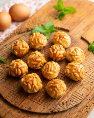 Panellets with pine nuts and almonds. A typical Catalan dessert made with marzipan and nuts.