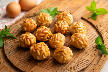 Panellets with pine nuts and almonds. A typical Catalan dessert made with marzipan and nuts.