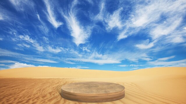 A minimalist stone pedestal stands on golden desert sand under a vast blue sky with wispy clouds, creating a natural stage for product display