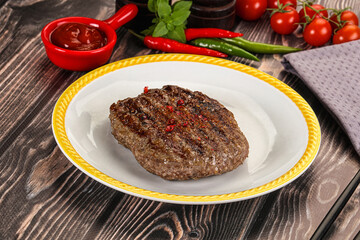 Grilled beef burger cutlet with sauce