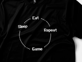 Black t-shirt featuring a 'Eat Sleep Game Repeat' cycle design, perfect for gamers and esports enthusiasts. Minimalist graphic typography expressing a daily routine for gaming passion.