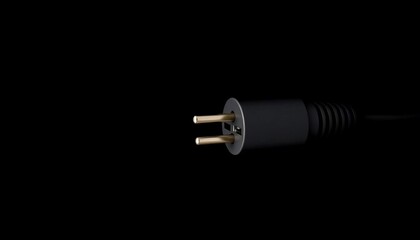 A black power plug against a pure black background,  design element,  dark background