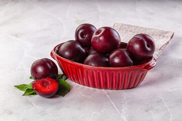 Raw ripe purple plum heap
