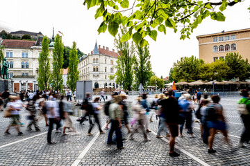 In Ljubljana’s lively center, countless visitors cross the square, highlighting the charm of the city and also the undeniable reality of mass tourism shaping the urban experience.
