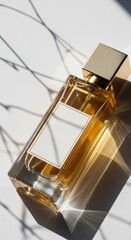 Elegant perfume bottle with gold accents isolated on white background