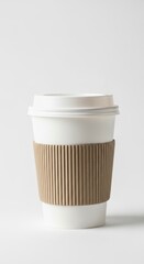 Disposable coffee cup with cardboard sleeve isolated on white background