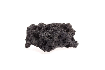 Volcanic rock with a textured surface, showcasing unique porous formations and dark coloration, representing natural geological processes and the beauty of earth's materials