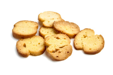 Golden-brown crispy bread slices arranged artistically on a white background, showcasing texture and color, perfect for culinary presentations and food photography