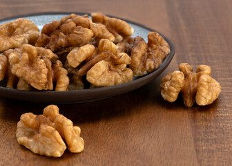 Deshelled Walnuts on wood