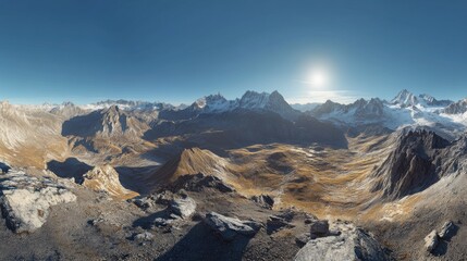 Obraz premium A sweeping vista showcases a vast mountain valley, bathed in sunlight, with snow-capped peaks rising majestically in the background.