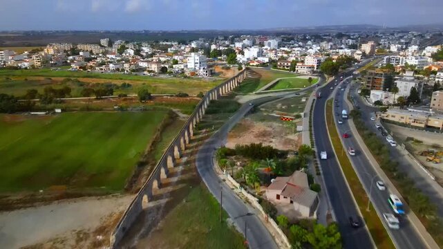 Aerial view of Larnaca, Cyprus. 
Morning traffic in the urban environment. Buildings, roads, cars and historical views.