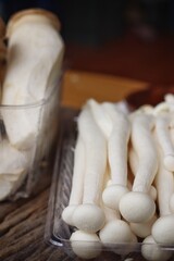 Fresh white shimeji mushrooms in tray