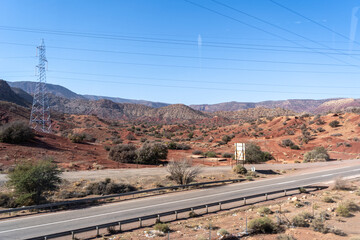 Obraz premium Morocco semi-deserts and mountains, north africa nature, Moroccan stone desert, red hills, villages and argan trees
