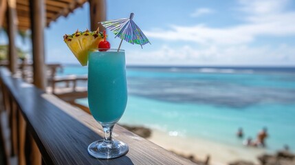 A vibrant blue cocktail stands out against a tropical ocean backdrop, garnished with pineapple and a cherry.