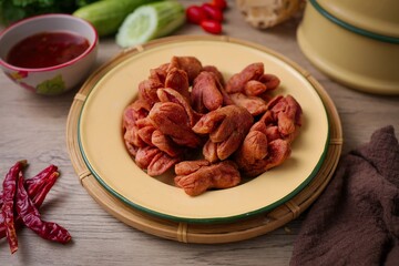 Deep Fried sausage with sauce in yellow plate