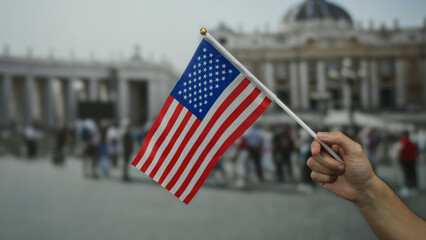 Man holding american flag in vatican city square with crowd in background, symbolizing...