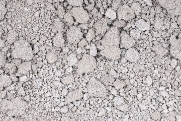 Texture of cracked concrete wall close-up. Damaged stone wall. Destroyed cement. crumbling stone