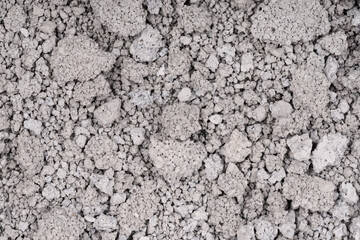 Texture of cracked concrete wall close-up. Damaged stone wall. Destroyed cement. crumbling stone