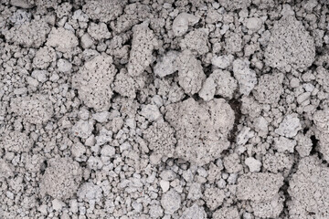 Texture of cracked concrete wall close-up. Damaged stone wall. Destroyed cement. crumbling stone