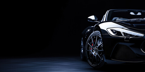 Front View of Luxury Black Sports Car with Headlight On in Dark Garage Setting