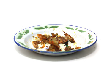 fish bone remains on a plate isolated on a white background