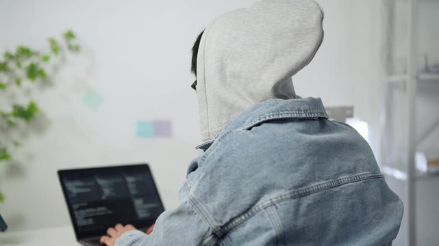 Cybersecurity professional working in a server room.
