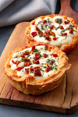 Mini Quiche perfect for brunch on black stone table