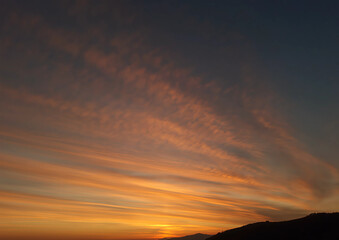 red sunset among the green hills in the evening, tramonto rosso tra le verdi colline di sera