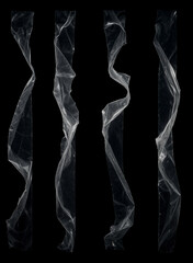 long strips of transparent adhesive tape are placed on a black background. Each strip is crumpled, twisted, or folded in different ways. The tape is bright and glossy, with light reflections 