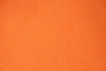 Plain orange textured background for design and creative use