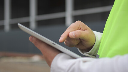 tablet.male engineer. construction site. high quality photo.