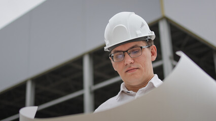 Study the drawing. Engineer looks at the drawing. High quality photo.