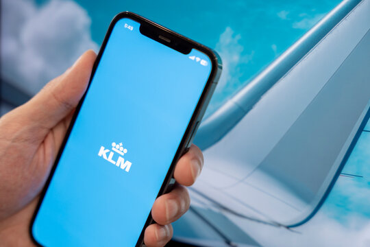 klm royal dutch airlines mobile app on smartphone with airplane wing in background - Seoul, South Korea - September 3 2025