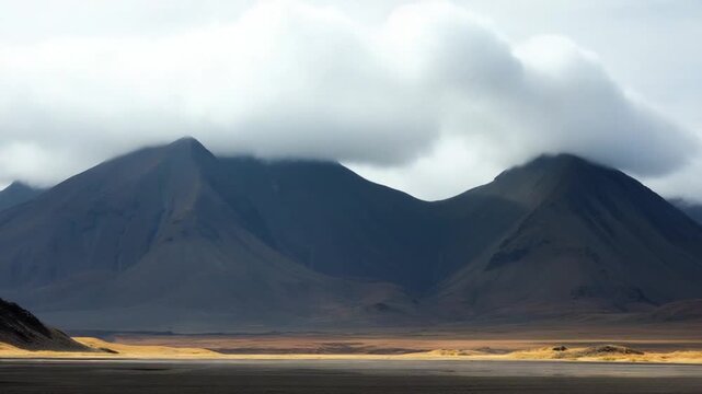 Clouds move over the mountains. Landmannalaugar volcanic massif in Iceland. Time lapse.