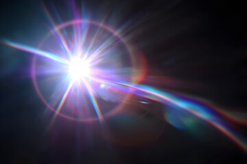A blurred rainbow lens flare with purple and blue colors on a black background.