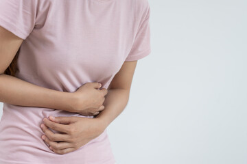 stomach ache. Asian women have abdominal pain, indigestion, gastritis, menstrual cramps,...