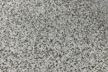 Gray gravel stone texture with small pebbles and rough surface, natural background for construction and design.