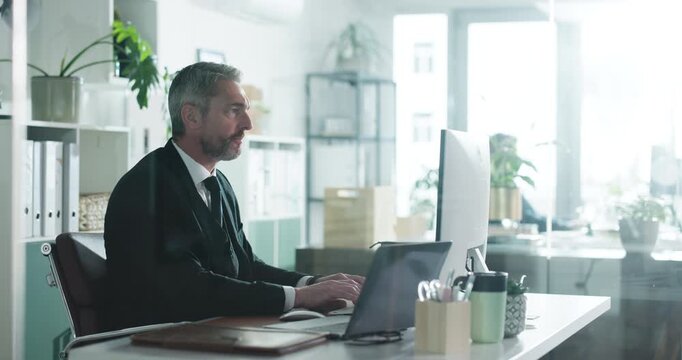 Computer, mature and business man typing email, environmental policy or thinking. Tech, sustainability manager or reading in office for green project, reflection or problem solving for csr report