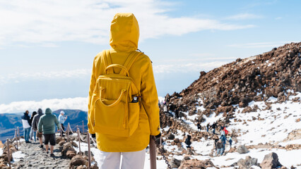 Tourist admiring rock formations in the Teide, Teide National Park, Tenerife, Canary Islands, Spain