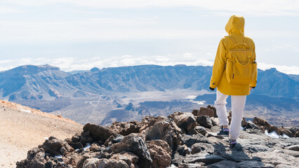 Tourist admiring rock formations in the Teide, Teide National Park, Tenerife, Canary Islands, Spain