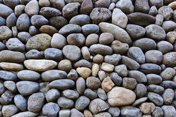 Close-Up Texture of Natural River Stones – Smooth Rock Background