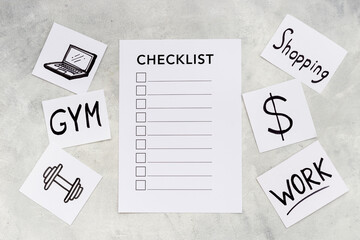 Checklist and many paper cards with hand drawing of different life activities, top view. Life balance and planning concept.