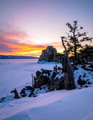 Winter sunset over frozen lake