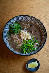 Aromatic pho noodle soup served with beef and vegetables.
