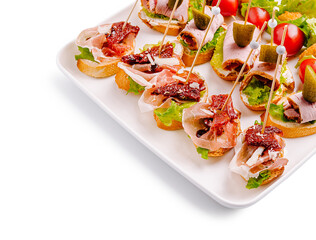 Delicious catering platter with assorted canapés at a festive gathering