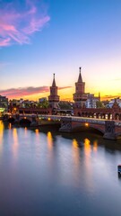 Obraz premium Sunset over a historic city bridge