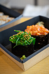 Gunkan with seaweed and with salmon.