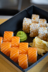 sushi set with wasabi in takeaway box.